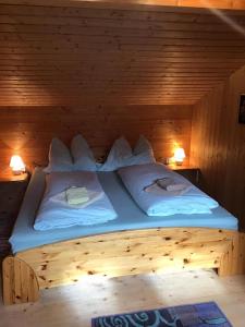 A bed or beds in a room at Ferienhaus Schäfer - Apartments - Wintersports - Family holiday - Holiday with your dog - Rural & Scenic