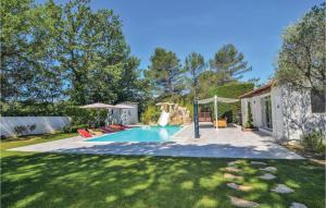 a pool with a slide in a yard at Pet Friendly Home In Trets With Heated Swimming Pool in Trets