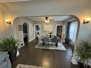 a dining room and living room with a table and chairs at Spacious Retreat Near Convention Centers home in Des Plaines