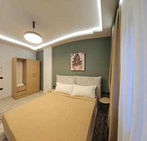 Postel nebo postele na pokoji v ubytování Oda Hotel Tirana