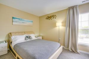 a bedroom with a large bed and a window at Atlantic City Home - Close to Casinos and Beach in Atlantic City