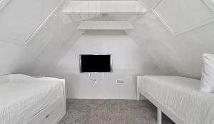 Ένα ή περισσότερα κρεβάτια σε δωμάτιο στο Beachside Bliss Beach House +20 φωτογραφίες