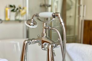 a close up of a silver lamp in a room at Althea House with parking in Padstow +17 photos
