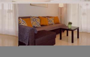 a living room with a couch and a table at Nice Apartment In Denia With Wifi in Denia