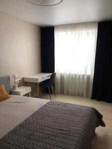 Rúm í herbergi á Like a home Voidu