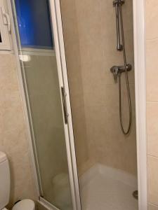 a shower with a glass door in a bathroom at Cap d Antibes, Salis beach , 2 bedrooms , free parking in Antibes