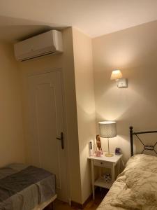 a bedroom with a bed and a nightstand with a bed sidx sidx sidx sidx at Cap d Antibes, Salis beach , 2 bedrooms , free parking in Antibes