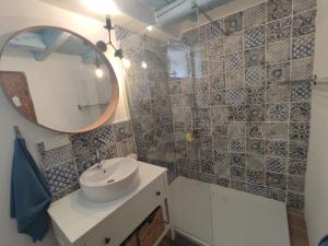 a bathroom with a sink and a mirror at Villa Kata in Rab