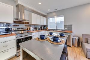 a kitchen with a table with three bowls on it at Pet-Friendly New Albany Home Less Than 7 Mi to Louisville! in New Albany