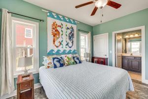 a bedroom with a bed and a ceiling fan at Ocean-View Apt in Emerald Isle - Walk to Beaches! in Emerald Isle