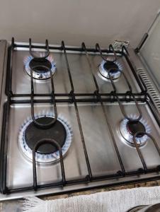 a stove top with four burners on it at Tranquilidade in Rio de Janeiro