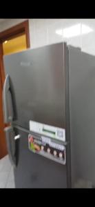 a refrigerator with the door open with food inside at Orient Tower - Tower C - Ajman city in Ajman 