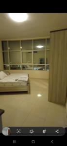a view of a room with a bed and cabinets at Orient Tower - Tower C - Ajman city in Ajman 