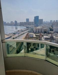 a view of the ocean from a balcony of a building at Orient Tower - Tower C - Ajman city in Ajman 