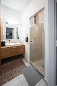 a bathroom with a sink and a shower at Modern, design lakás a Margit-sziget mellett in Budapest