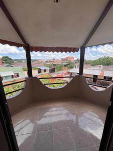 an empty room with a view from a window at Casa Amigable y Confortable in Yacuiba