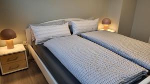 Postel nebo postele na pokoji v ubytování Haus Spökenkieker Loppersum