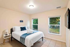 a bedroom with a bed and a window at The Lake House in Canyon Lake