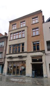 a building on the corner of a street at Corso studio 0303 in Leuven