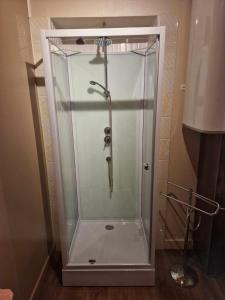a shower with a glass enclosure in a bathroom at ESCALE AU CLOS SAINT MARTIN DE JUILLERS Gîtes et Chambres d'hôtes in Saint-Martin-de-Juillers