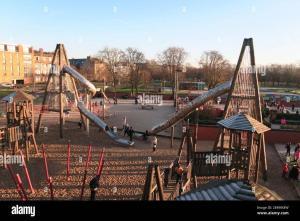 a playground with a slide in a park at Fab Location 1 bed Apt overlooking Glasgow Green in Glasgow