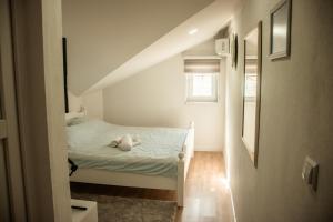 Postel nebo postele na pokoji v ubytování Apartments Bašić