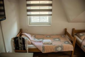 Postel nebo postele na pokoji v ubytování Apartments Bašić