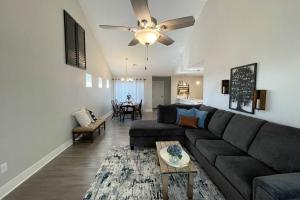 a living room with a couch and a table at New Beautiful 3 Bedroom Condo in Bettendorf in Bettendorf