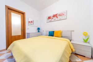 Postel nebo postele na pokoji v ubytování Casa di Jennifer 3