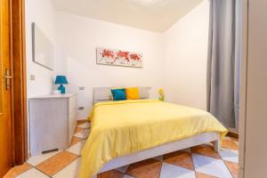 Postel nebo postele na pokoji v ubytování Casa di Jennifer 3