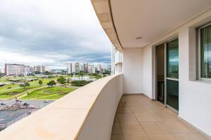 a balcony of a building with a view of the city at GS Properties - Hotel Líder in Brasilia