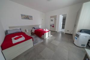 a small bedroom with two beds and a heater at Il tramonte in Vinchiaturo