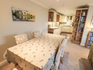 a kitchen and dining room with a table and chairs at Middlerigg in Ambleside