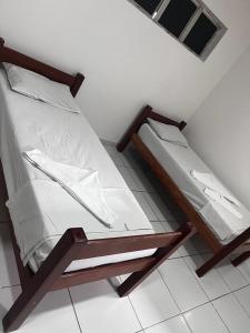 Uma cama ou camas num quarto em POUSADA MARINHA DO CEU