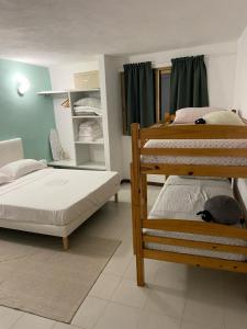 a bedroom with two bunk beds at La casa degli Ulivi in Camporosso