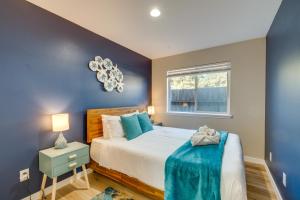 a bedroom with a bed and a window at Ocean Shores Escape Less Than Half-Mi to Damon Point Beach in Ocean Shores