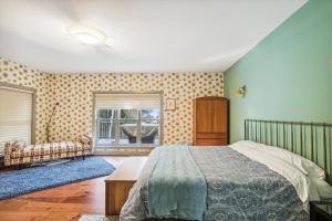 a bedroom with a bed and a window at Cody's Clubhouse in Waterbury Center
