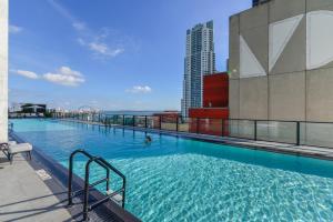 a large swimming pool on top of a building at Stylish Condo near Bayside Park: Amazing Views Await in Miami