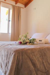 Cama ou camas em um quarto em Tierra Patagonica Departamentos