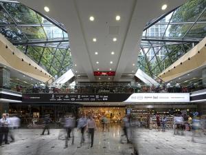 a group of people walking around a shopping mall at Superior Canary Wharf O2 Arena 2Bed Apartment in London