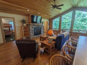 a living room with a couch and a fireplace at Hanging Rock Get Away in Bigfork