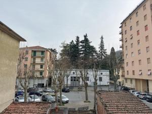 arial view of a parking lot in a city with cars at Orchidea House in Serravalle Scrivia