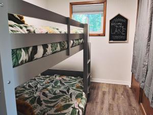 a bedroom with two bunk beds in a room at Woods Bay Get-A-Way in Bigfork