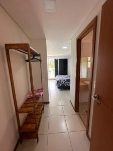 a room with a staircase and a room with a bed at Apartamento Térreo no Catu Lake Resort Aquiraz in Aquiraz +11 photos