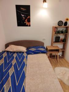 a couch in a living room with a tie on it at Oaza031 in Užice