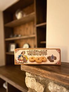 a box of cookies sitting on top of a counter at Bumble Bee Cottage Witney Serviced accommodation in Witney