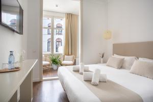 Postel nebo postele na pokoji v ubytování Divino Hotel Boutique