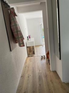 a room with a hallway with a wooden floor at Villa am Fluß in Pforzheim