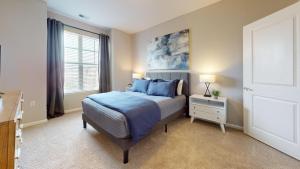 A bed or beds in a room at H4N Furnished Apartments Near Naval Station Norfolk