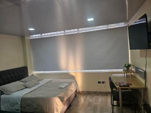 Postel nebo postele na pokoji v ubytování Roma House V- Campin Movistar El Cubo